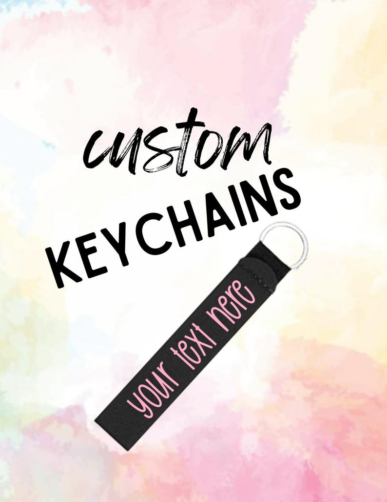 May include: Black custom keychain with the text "custom keychains" and "your text here" in pink lettering.