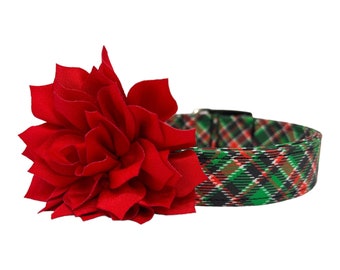 May include: A red fabric flower attached to a green, red, and black plaid dog collar.