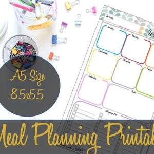 May include: A printable weekly meal planner in A5 size (8.5 x 5.5 inches). The planner has a gray background with a colorful floral pattern and a white grid with colorful borders for each day of the week. The planner also includes a shopping list section.