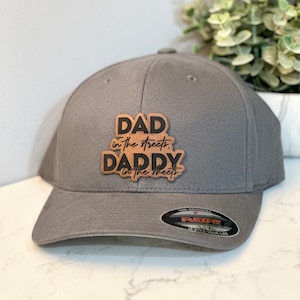 May include: Gray baseball cap with a brown leather patch that reads "DAD in the streets, DADDY in the sheets".