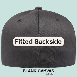 May include: A dark grey baseball cap with a curved peak. The back of the cap features the text "Fitted Backside" in a white, rectangular box. Below, the text "BLANK CANVAS" and "by Potter" are printed in black.
