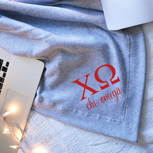 Manta oficial de la hermandad CHI OMEGA