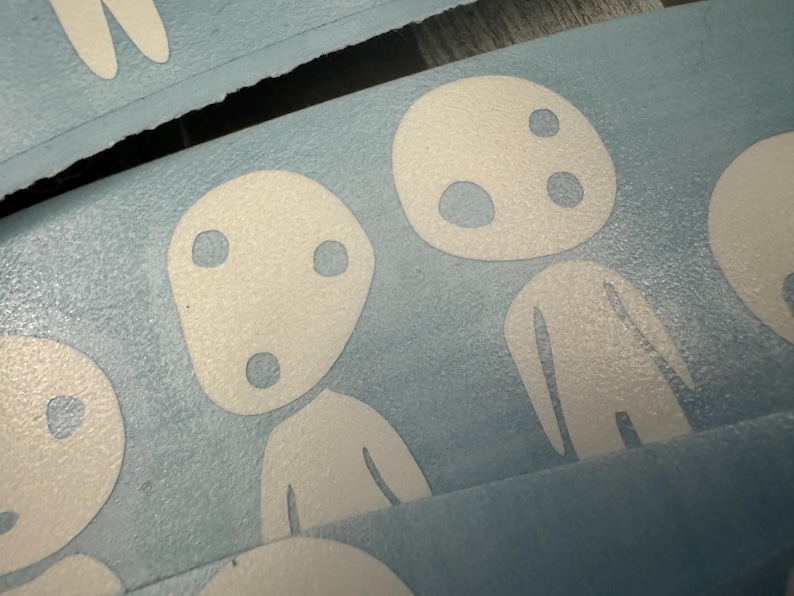 May include: A blue background with white cartoon characters. The characters have round heads with two black eyes and a mouth. The characters are standing with their arms at their sides.