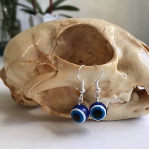 Blue evil eye bead silver plated dangle earrings