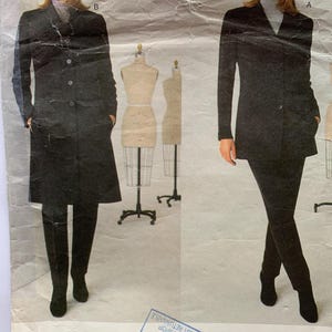May include: Vogue Patterns sewing pattern for a black coat and trousers by Calvin Klein. The pattern number is 2005. The size range is 20-22-24.