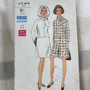 May include: A vintage Vogue sewing pattern envelope, number 7631, size 12, bust 86cm. The illustration shows two outfits: a solid light-coloured jacket and skirt set with a matching headpiece, and a plaid jacket and skirt set in brown and white.