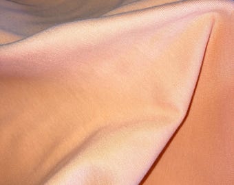 Organic Cotton Knit Fabric. Peach Organic Cotton/Spandex Knit. Stretchy Knit Fabric. Children's Clothing Fabric. Pajama Fabric. Baby Fabric