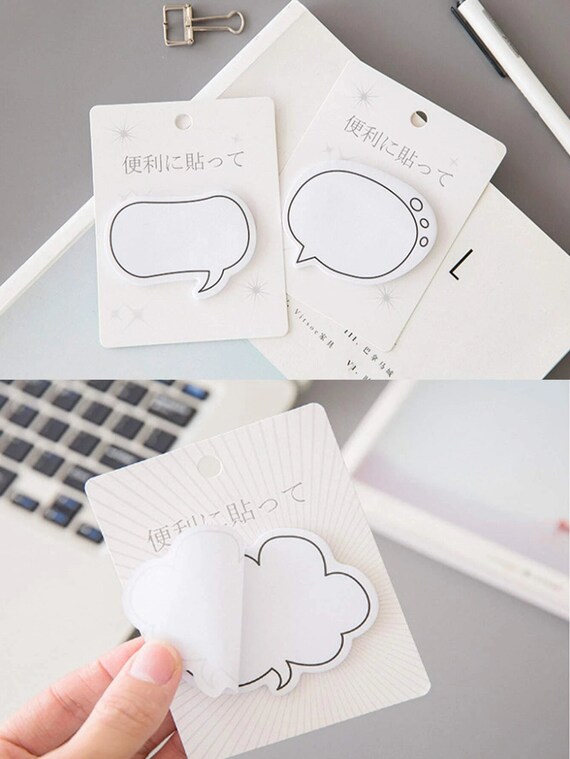 A Cloud Speech Bubble Over a Pad of Sticky Notes · Free Stock Photo