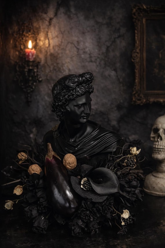 A one-of-a-kind gothic bust of David buried in a dark floral arrangement — moody, sculptural, and genuinely unlike anything you'd find in a store.