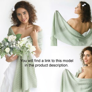 May include: A sage green knitted shawl draped over a person's shoulders. The shawl is soft and lightweight, making it perfect for a wedding or other special occasion.