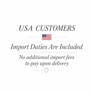 May include: A white graphic with dark grey text that reads USA CUSTOMERS, followed by a small American flag icon, then the text Import Duties Are Included, No additional import fees to pay upon delivery, and a small heart icon at the bottom.