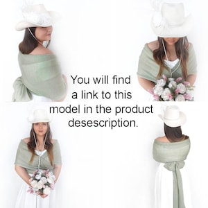 May include: Three women wearing white cowboy hats and sage green shawls. The shawls are tied around the neck and drape down the back. The women are wearing white dresses and holding bouquets of flowers.
