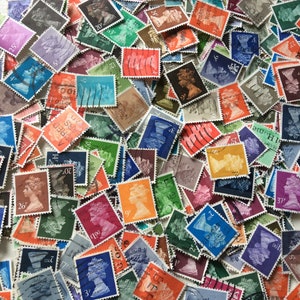 May include: A collection of vintage postage stamps featuring a variety of designs and colors. The stamps are mostly rectangular and have a serrated edge. Some of the stamps feature a portrait of a woman, while others feature images of buildings, animals, and other objects.