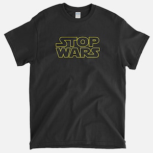 May include: Black t-shirt with a yellow outline of the text "STOP WARS" in a Star Wars font.