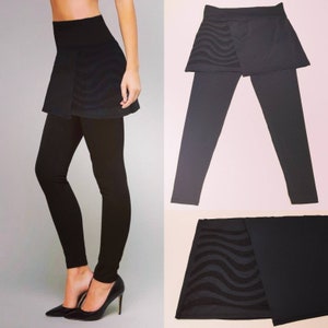 Black leggings with integrated skirt, asymmetrical pattern sewn and carved by hand on stretch tulle.