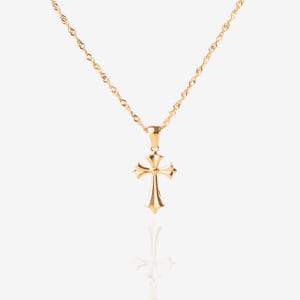 May include: A gold chain necklace with a small, ornate gold cross pendant.