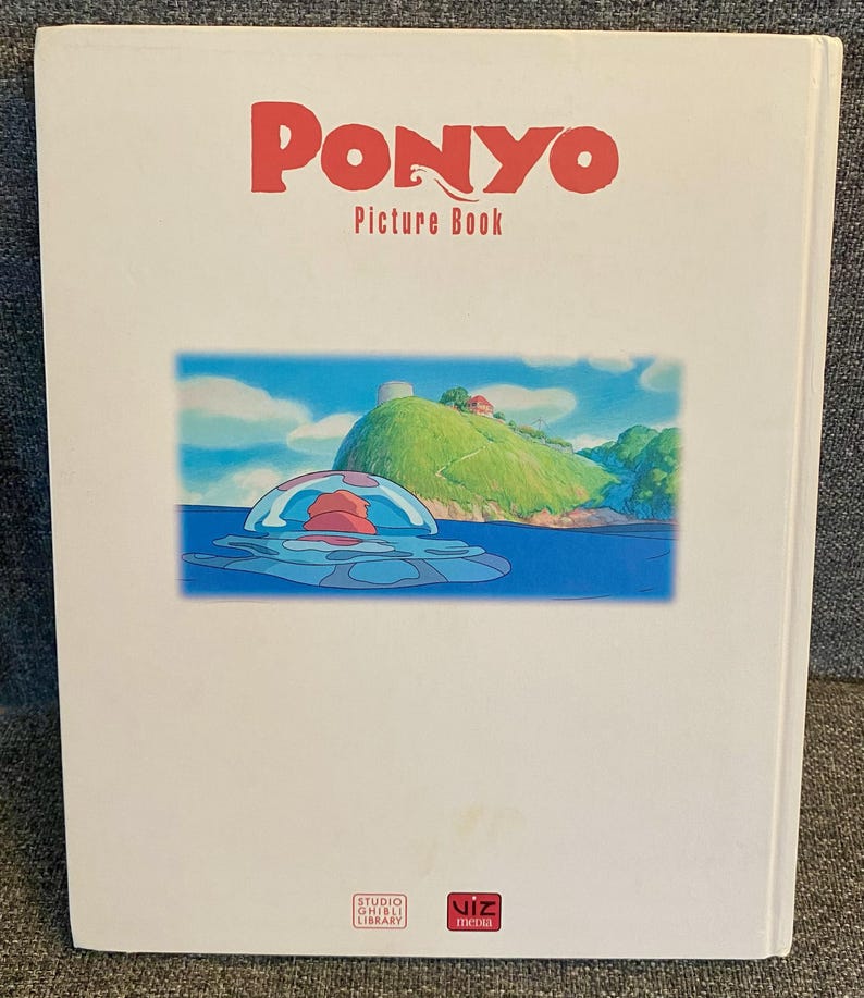 May include: A white "Ponyo Picture Book" with red text. The cover features a colorful illustration of a sea scene with a red and blue jellyfish-like creature. The book is from Studio Ghibli Library and Viz Media.