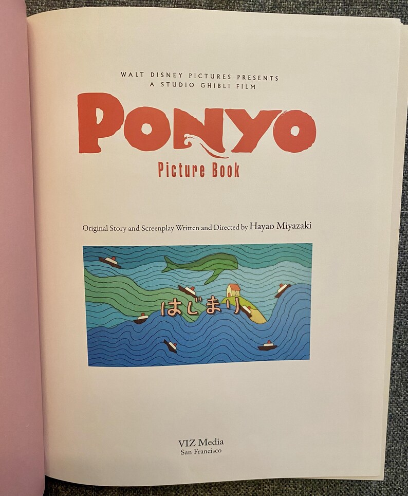 May include: Open book with the title "PONYO" in large red letters. Below, it reads "Picture Book." The image features a colorful illustration of a green sea, boats, and Japanese text. The book is published by VIZ Media.