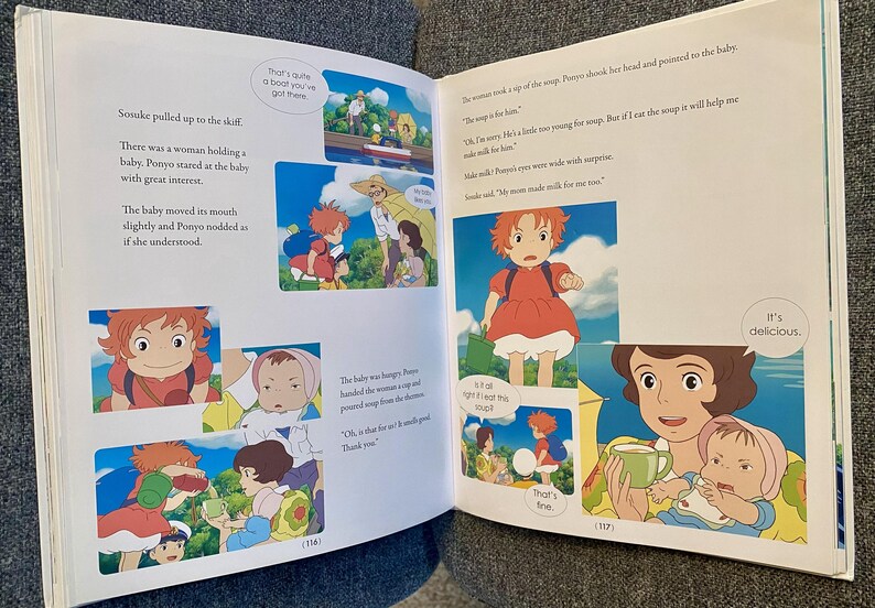May include: Open book with colorful illustrations from an animated film. The images depict a young girl with red hair and a baby, with text bubbles containing dialogue. The text on the page reads, "It's delicious."