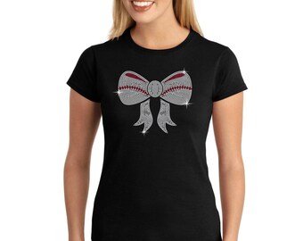 May include: A black t-shirt with a rhinestone bow design. The bow is silver with red accents.