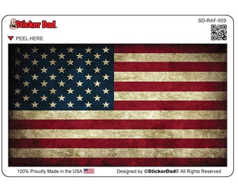 May include: A rectangular sticker featuring the American flag with a distressed, vintage look. The flag has red and white stripes and a blue field with white stars. The text "PEEL HERE" is visible, along with the Sticker Dad logo and the text "100% Proudly Made in the USA".