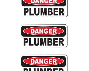 May include: Three black and white warning signs with red text. Each sign reads "DANGER PLUMBER".