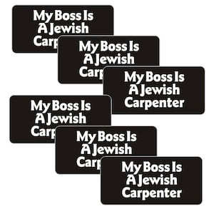 May include: Six black and white stickers with the text "My Boss Is A Jewish Carpenter" repeated on each sticker.