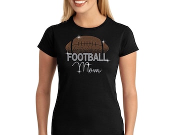May include: Black t-shirt with a brown and silver rhinestone football design and the text "FOOTBALL Mom".