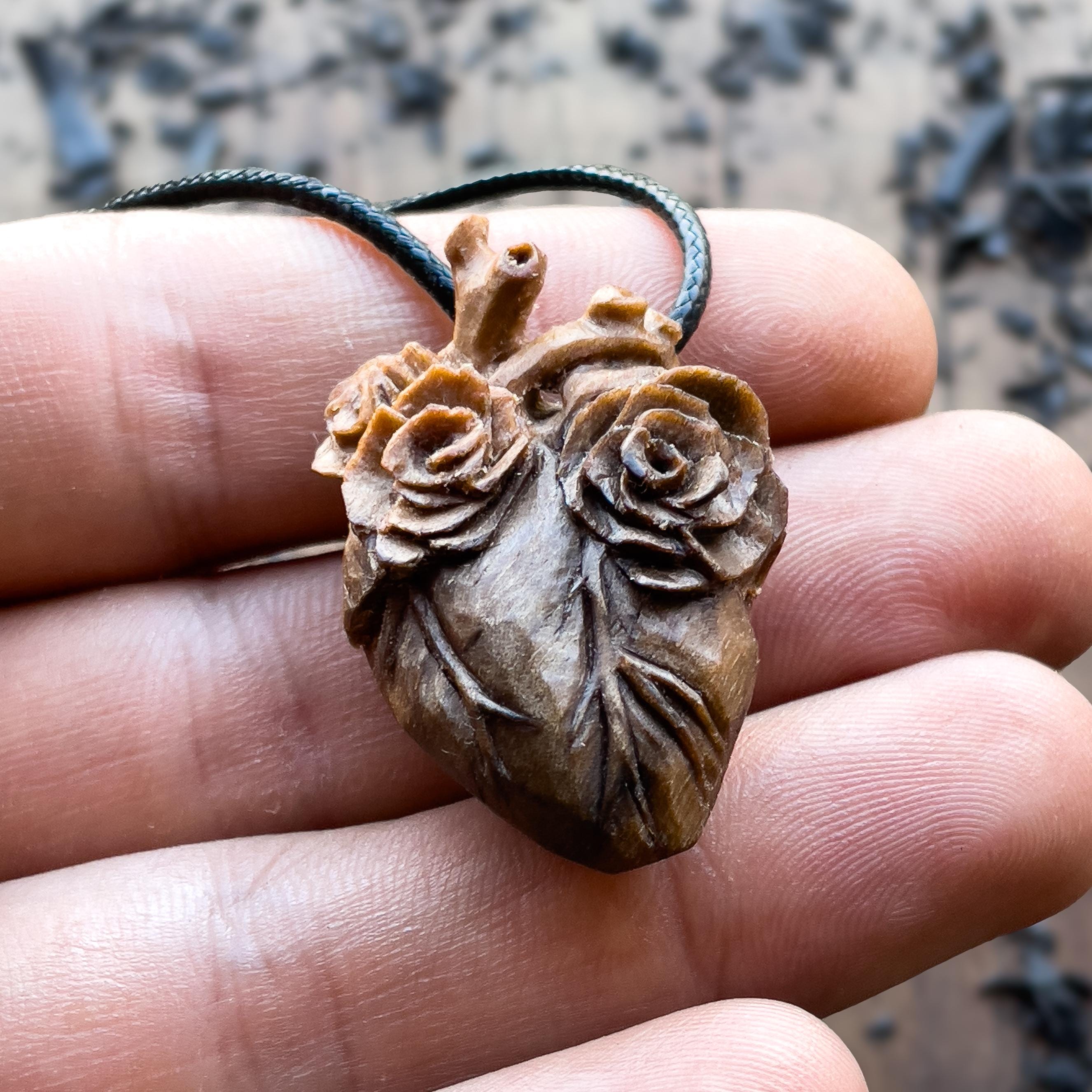 Handcarved Anatomical Heart Pendant With Design of Three Roses