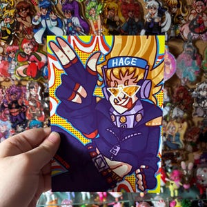 May include: A colorful illustration of a character with blonde hair, sunglasses, and the word "HAGE" on a headband. The character is wearing a dark purple outfit and making a peace sign. The background is yellow with a pop art style.