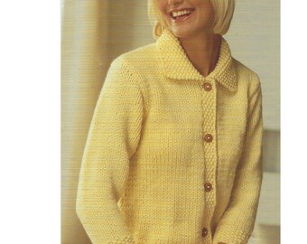 May include: A yellow knitted cardigan with a collar and button closure. The cardigan has a subtle texture and is a light, airy fabric.