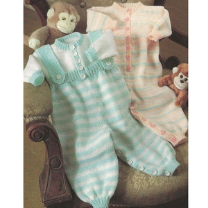 May include: Two knitted baby sleepsuits, one in white and light blue stripes and one in pink and white stripes. Both sleepsuits have button fastenings and are shown on a wooden chair.
