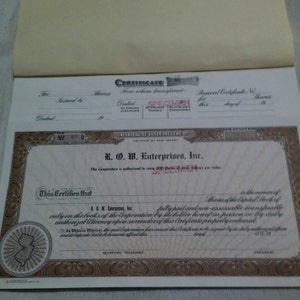 1970s complete book of used and unused stock certifcates