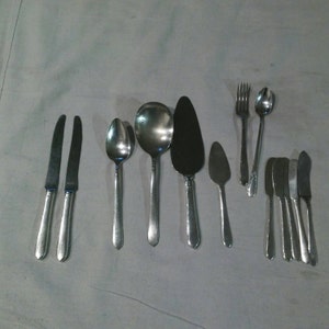 13 piece 1935 Bedford square  assorted silver plated community silverware