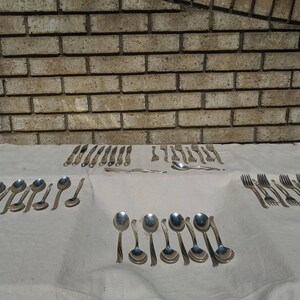 42 piece W M Rogers antique silverware set
