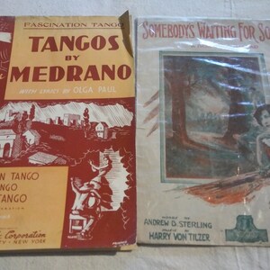 May include: Two vintage sheet music covers. The left cover is red and yellow and features the text "Tangos by Medrano" with the song titles "Fascination Tango", "Inca Tango", and "Besame Tango". The right cover is white and features a woman in a forest setting with the text "Somebody's Waiting for Someone".