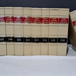 May include: A collection of beige-colored law books titled "New Jersey Reports." The spines have red labels with white text. Numbers 107 through 118 are visible on the spines. The books are arranged in a row and leaning against each other.