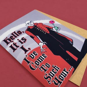 Original illustration Junkyard Bunnie A2 Nosferatu greeting card, printed on premium matte cardstock with a kraft envelope on a maroon photography backdrop.