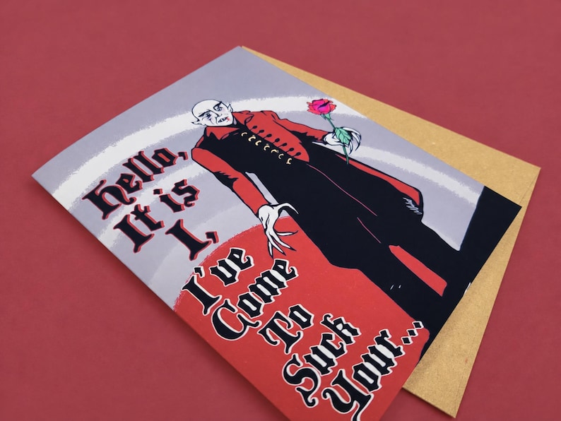 Original illustration Junkyard Bunnie A2 Nosferatu greeting card, printed on premium matte cardstock with a kraft envelope on a maroon photography backdrop.