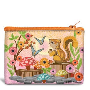 May include: A rectangular zippered pouch with a whimsical woodland scene. It features a cartoon squirrel holding a nut, butterflies, mushrooms, and flowers in shades of pink, orange, and green. The pouch has an orange zipper and trim.