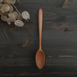Handmade stirring wooden spoon from beech Universal cooking spoon