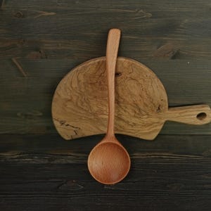 Round shallow cooking and serving spoon hand carved from beech wood Handmade kitchen wooden spoon