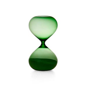 May include: A translucent green glass hourglass with a smooth, rounded bulbous shape. The object features a narrow centre neck connecting the two symmetrical chambers, showcasing a vibrant emerald hue throughout the entire glass structure.