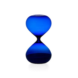 May include: A vibrant cobalt blue hourglass featuring a smooth, rounded glass construction with a narrow centre neck. The object displays a deep, saturated blue hue throughout its entire form, creating a translucent appearance with a distinct silhouette.