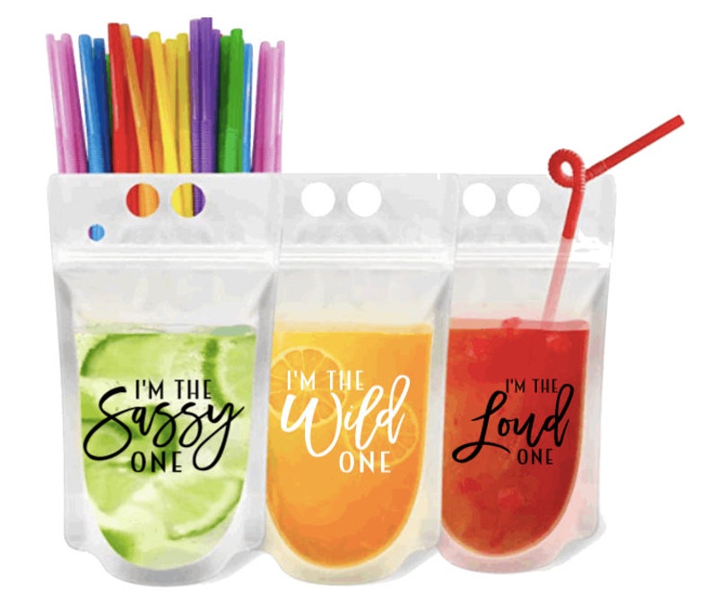 May include: Three clear plastic pouches with colorful drinks and straws. The pouches have text that reads "I'm the Sassy One", "I'm the Wild One", and "I'm the Loud One".