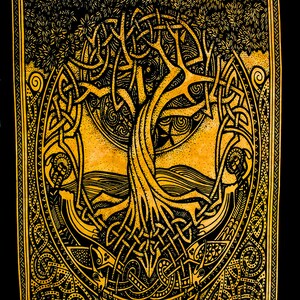 May include: A black and gold tapestry featuring a Celtic knot design with a tree of life motif. The tree has intricate branches and roots, and the background is a dark, textured fabric.