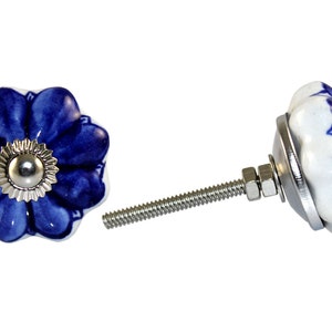 May include: Blue and white ceramic flower-shaped cabinet knob with a silver screw and nut.