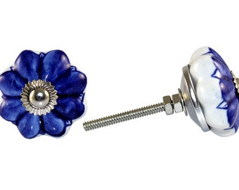 May include: Blue and white ceramic flower-shaped cabinet knob with a silver screw and nut.