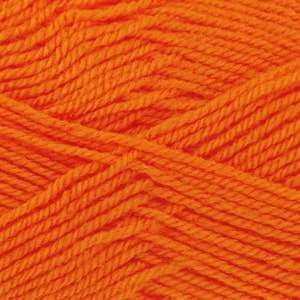 May include: Close-up of orange yarn with a textured, woven pattern.
