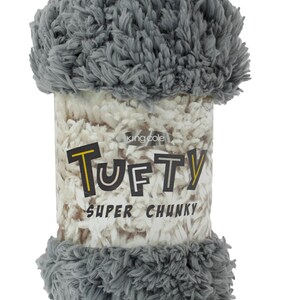 May include: A gray and white super chunky yarn ball with the text "Tufty" and "King Cole" on the label.